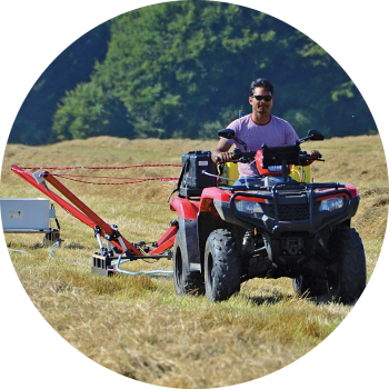 The TEMcompany tTEM towed geophysical scanner in use in a field.